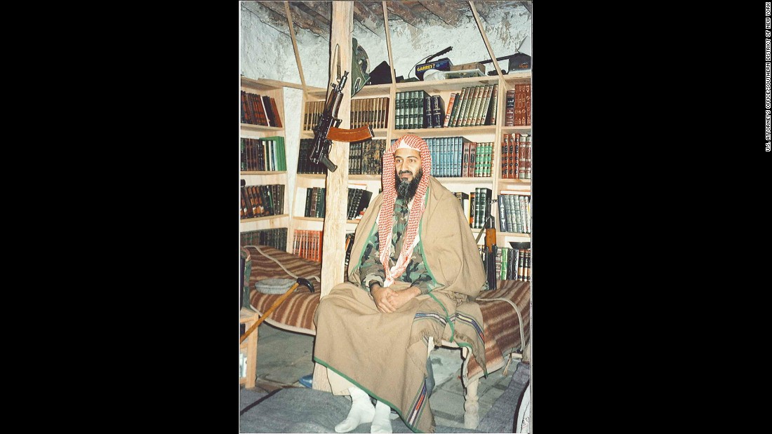Bin Laden sits in front of his bookshelves inside his Tora Bora hideout. His three wives and more than a dozen children struggled with the sparse amenities. The only heat came from a wood-burning stove.