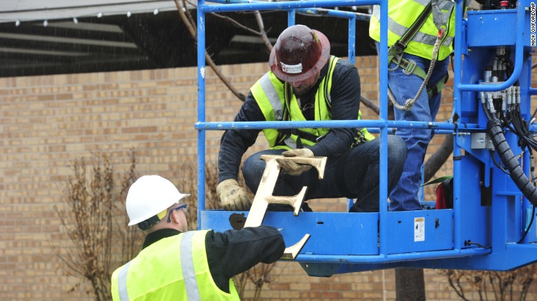 Facility workers removed the letters from the SAE house at the University of Oklahoma on Monday, March 9.