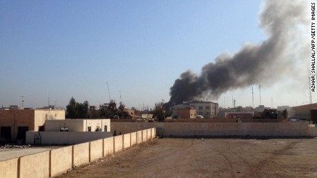 Smoke billows after a mortar shell hit an Anbar governorate building in Ramadi, Iraq, on Wednesday, March 11. ISIS launched a coordinated attack on government-held areas of the western Iraqi city.