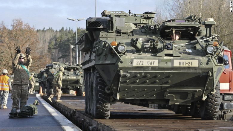 Dragoons assigned to Head Hunter Troop, 2nd Squadron, 2nd Cavalry Regiment load their Strykers and equipment onto a local railway as they prepare for their upcoming rotation in support of Operation Atlantic Resolve at Rose Barracks, Germany, March 11, 2015. 