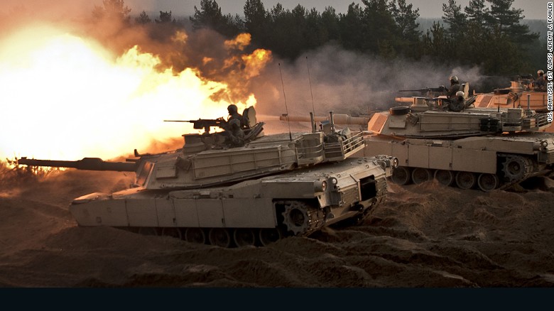 U.S. soldiers fire ceremonial rounds from M1A2 Abrams tanks at the Adazi training area, in Latvia, last November. 