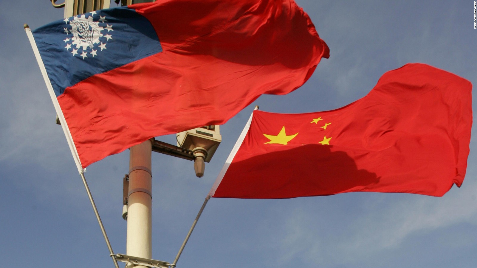 The flags of Myanmar (L) and China, which sent fighter jets to patrol over their shared border after the incident.