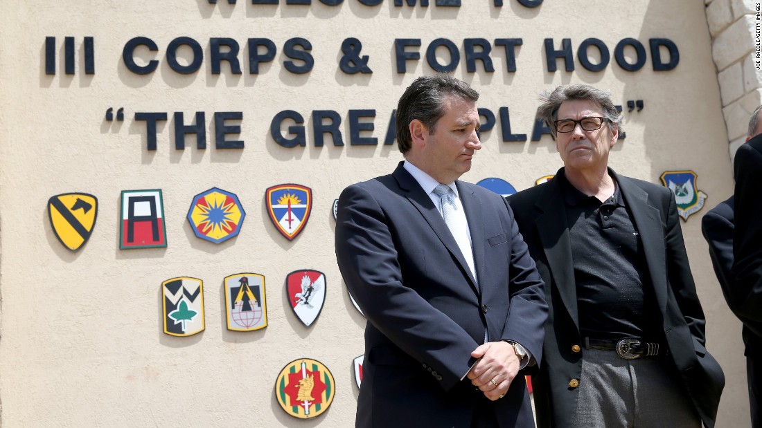 Cruz (left) and then-Texas Governor Rick Perry stand together during a press conference at the front gate of Fort Hood about Iraq war veteran, Ivan Lopez, who killed three and wounded 16 before taking his own life on April 4, 2014, in Fort Hood, Texas.