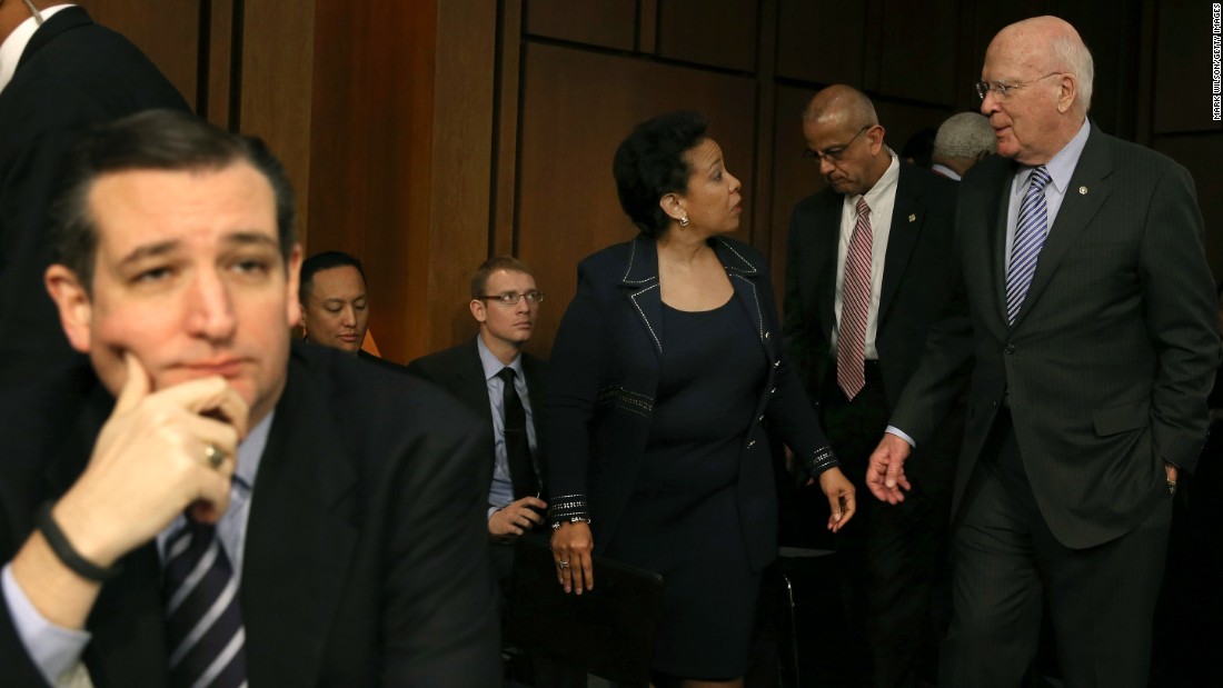 Sen. Patrick Leahy (right) escorts Loretta Lynch back from a lunch break as Cruz  (left) sits nearby during her confirmation hearing before the Senate Judiciary Committee January 28, 2015, on Capitol Hill.