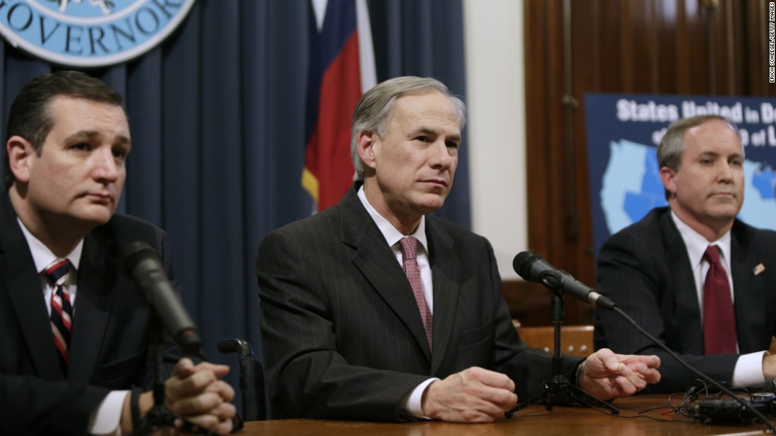 Governor Greg Abbott (center) speaks alongside Cruz (left), Attorney General Ken Paxton (right) at a joint press conference February 18, 2015, in Austin, Texas.