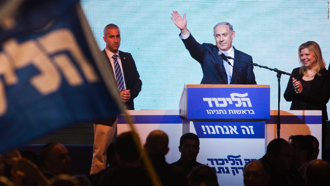 Israeli Prime Minister Benjamin Netanyahu greets supporters at the Likud party's election headquarters in Tel Aviv, Israel, on Wednesday, March 18. Netanyahu appears poised to keep his job after Likud grabbed at least 29 of the 120 seats in Israel's parliament, according to unofficial numbers. The Zionist Union came in second, with at least 24 seats.