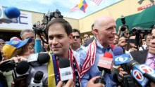 Rubio, left, and Florida Gov. Rick Scott speak to the media in Doral in February 2014.
