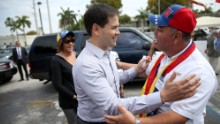 Rubio, left, is greeted as he arrives at a restaurant in Doral in February 2014.