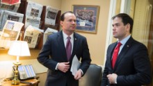 Sen. Mike Lee, left, and Rubio talk before a news conference to introduce their proposal for an overhaul of the tax code in March.