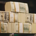 Stacks of money are seen in what is being called a first-of-its-kind exhibit of five million dollars in cash at the Seminole Hard Rock Hotel & Casino on March 18, 2009 in Hollywood, Florida. The display consists of $100 bills encased in a 1,300-pound, custom-made $90,000 bullet-resistant Lexan showcase. (Photo by Joe Raedle/Getty Images)