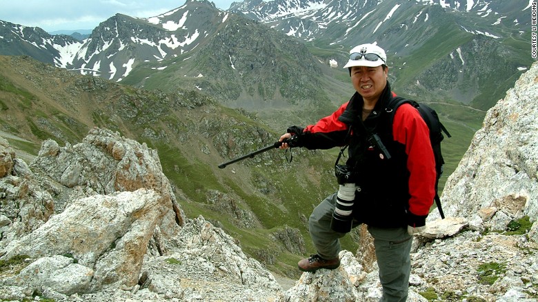 Scientist Li Weidong points to where he and his team spotted the Ili pika in July 2014. 