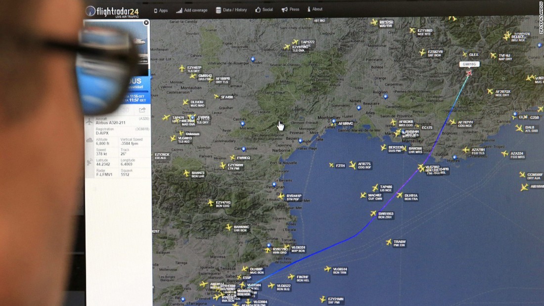 A man in Madrid looks at a monitor with a map, released from the Flightradar24 website, showing the point where the plane's radar signal went missing.