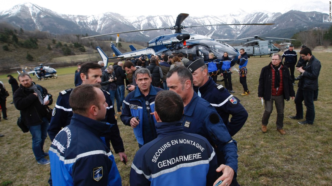 Rescue workers and members of the French Gendarmerie gather in Seyne-les-Alpes on Tuesday, March 24, as search-and-rescue teams struggle to reach the remote crash.