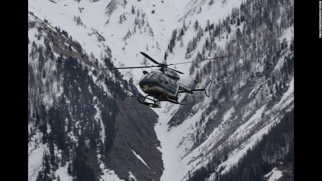 A helicopter comes in to land near Seyne-les-Alpes, the staging ground for search efforts, on March 25.