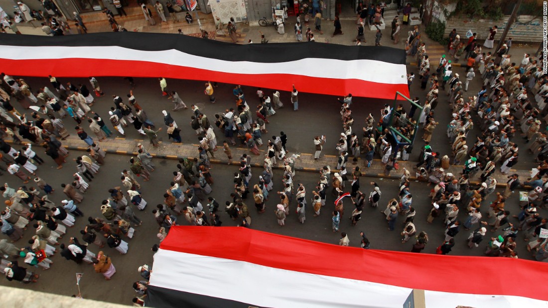 Houthi supporters in Sanaa deploy giant national flags Wednesday, March 18, during a demonstration to mark the fourth anniversary of the &quot;Friday of Dignity&quot; attack. In 2011, forces loyal to Saleh &lt;a href=&quot;http://www.cnn.com/2011/10/15/world/meast/yemen-unrest/&quot; target=&quot;_blank&quot;&gt;opened fire on protesters&lt;/a&gt; who had gathered in Sanaa to demand the ouster of Saleh and his regime.