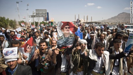 Supporters of Ahmed Ali Abdullah Saleh, the son of the former President, wave banners and shout slogans during a demonstration in Sanaa on Tuesday, March 10. The demonstrators were demanding presidential elections be held and that the younger Saleh run for office.