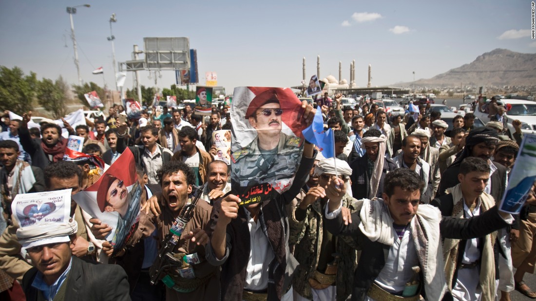 Supporters of Ahmed Ali Abdullah Saleh, the son of the former President, wave banners and shout slogans during a demonstration in Sanaa on Tuesday, March 10. The demonstrators were demanding presidential elections be held and that the younger Saleh run for office.