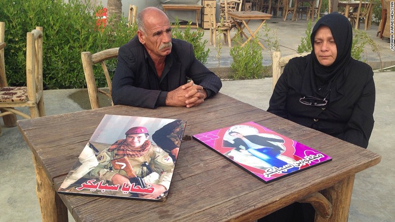 The parents of Imad al-Jubouri, one of the missing recruits, tell their story at a restaurant in Baghdad on March 29, 2015.