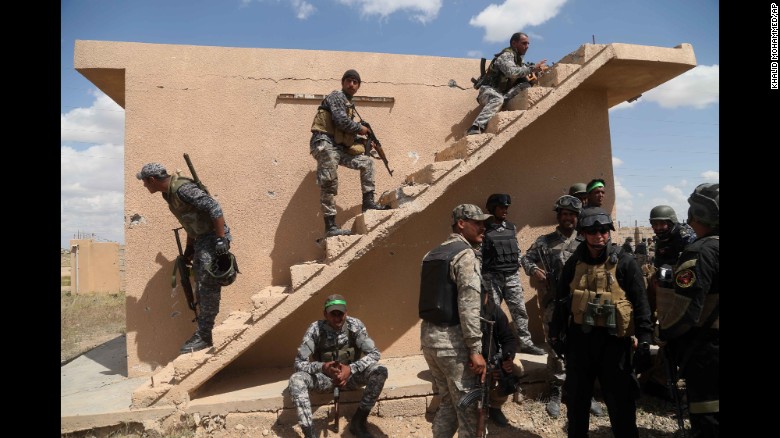 Iraqi security forces and Shiite militiamen prepare to attack ISIS militants in Tikrit on Tuesday, March 31. Ousting ISIS from Tikrit was an important step for the coalition, which is trying to thwart the extremist group&#39;s quest to grow its caliphate.