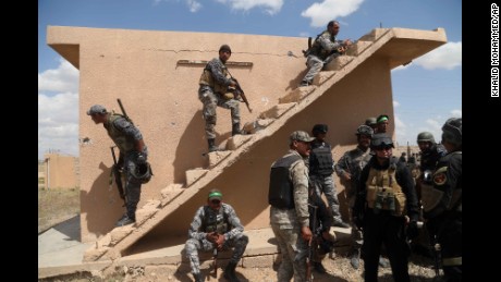 Iraqi security forces and Shiite militiamen prepare to attack ISIS militants in Tikrit on Tuesday, March 31. Ousting ISIS from Tikrit was an important step for the coalition, which is trying to thwart the extremist group's quest to grow its caliphate.