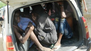 Students of the Garissa University College take shelter in a vehicle after fleeing from an attack by gunmen in Garissa, Kenya, Thursday, April 2, 2015. Gunmen attacked the university early Thursday, shooting indiscriminately in campus hostels. Police and military surrounded the buildings and were trying to secure the area in eastern Kenya, police officer Musa Yego said. (AP Photo)
