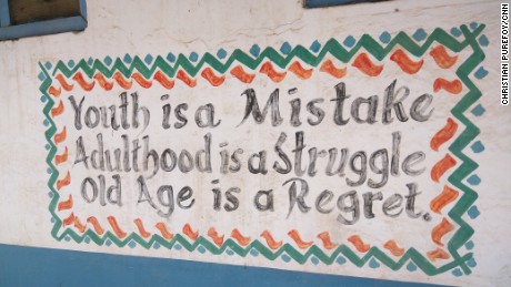 A sign outside the Ibnu-Siina school provides some small light relief to students who live in constant fear of an attack.