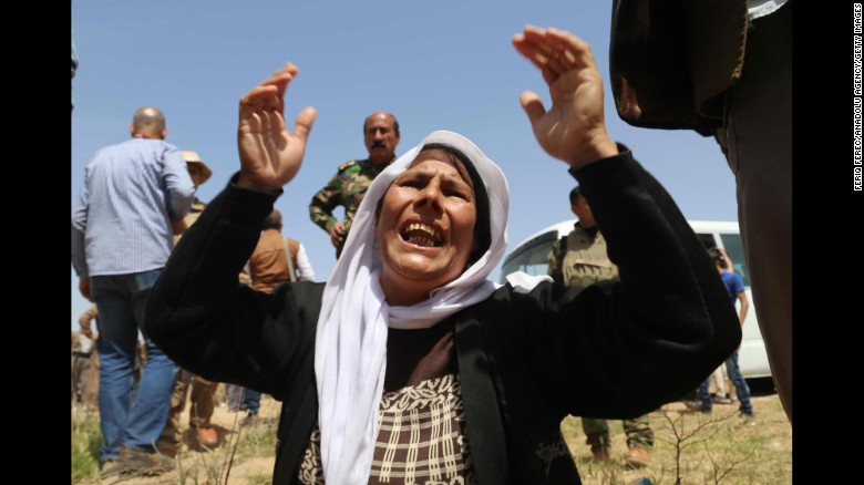 A Yazidi woman mourns for the death of her husband and children by ISIS after being released south of Kirkuk on April 8.