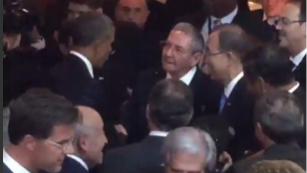 President Obama greets and shakes hands with Cuban leader Raul Castro at the Summit of the Americas in Panama City, Panama.