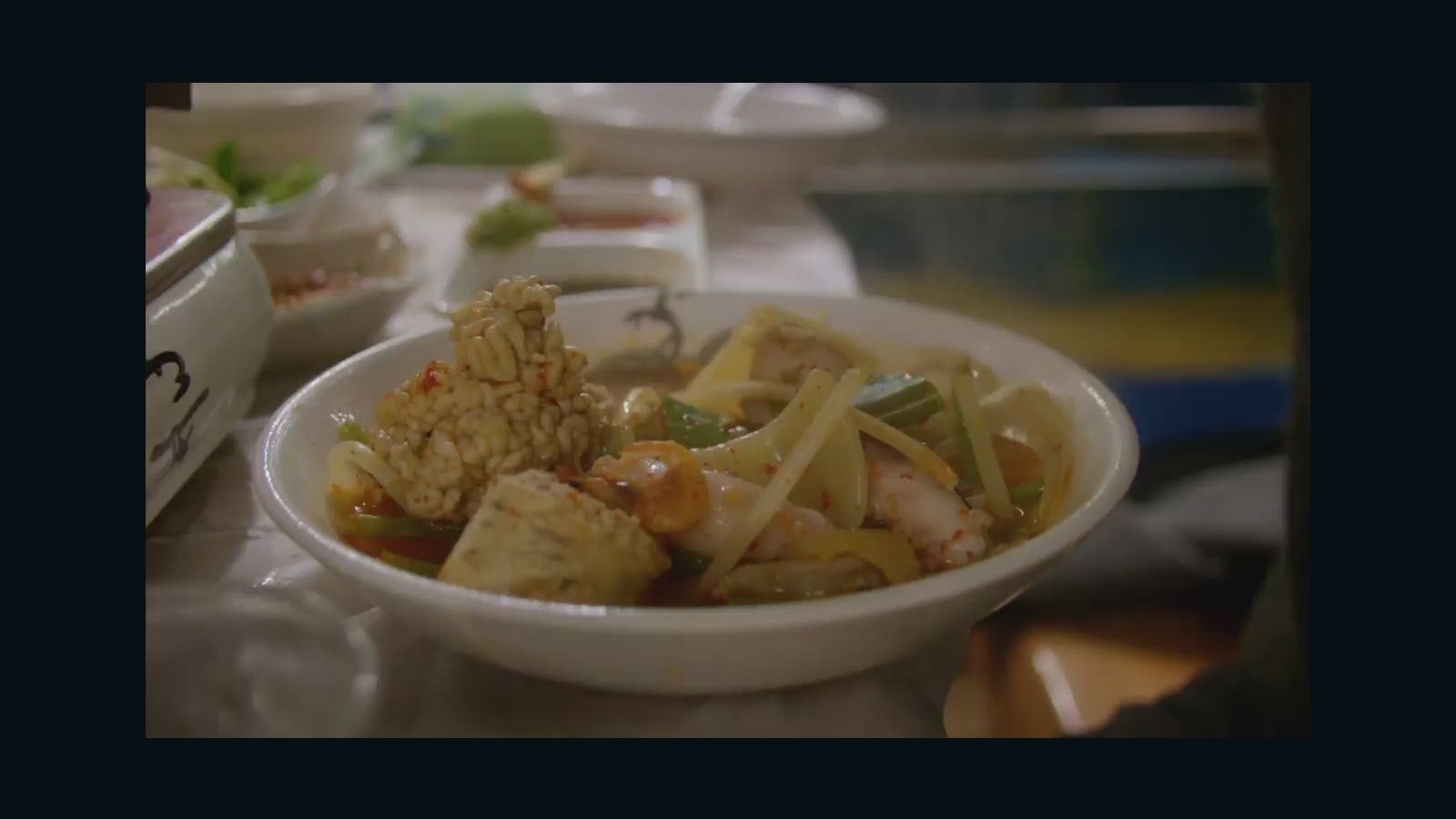 Share a bubbling hot pot with Bourdain