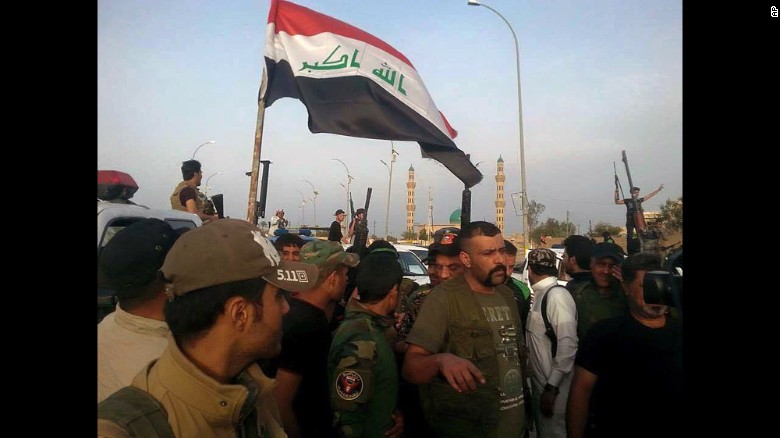 Iraqi security forces and tribal fighters gather before attacking ISIS militants in Ramadi on Wednesday, April 15.