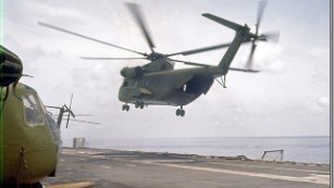 A powerful CH-53 Sea Stallion helicopter departs the USS Hancock to evacuate Saigon in April, 1975.