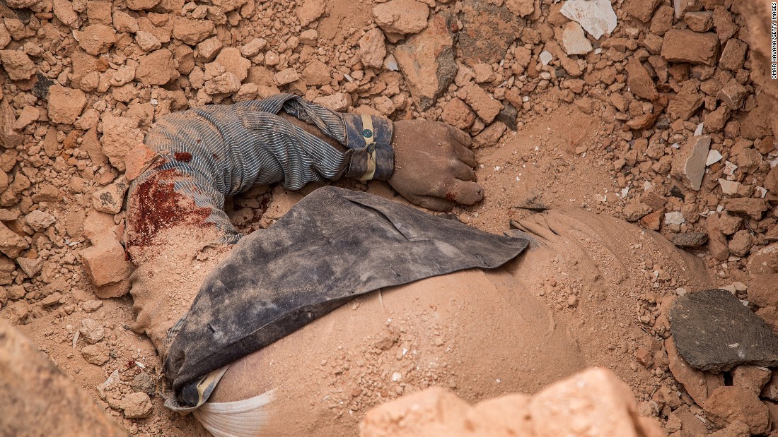 A victim&#39;s body is seen in the debris of the collapsed Dharahara on April 25. 