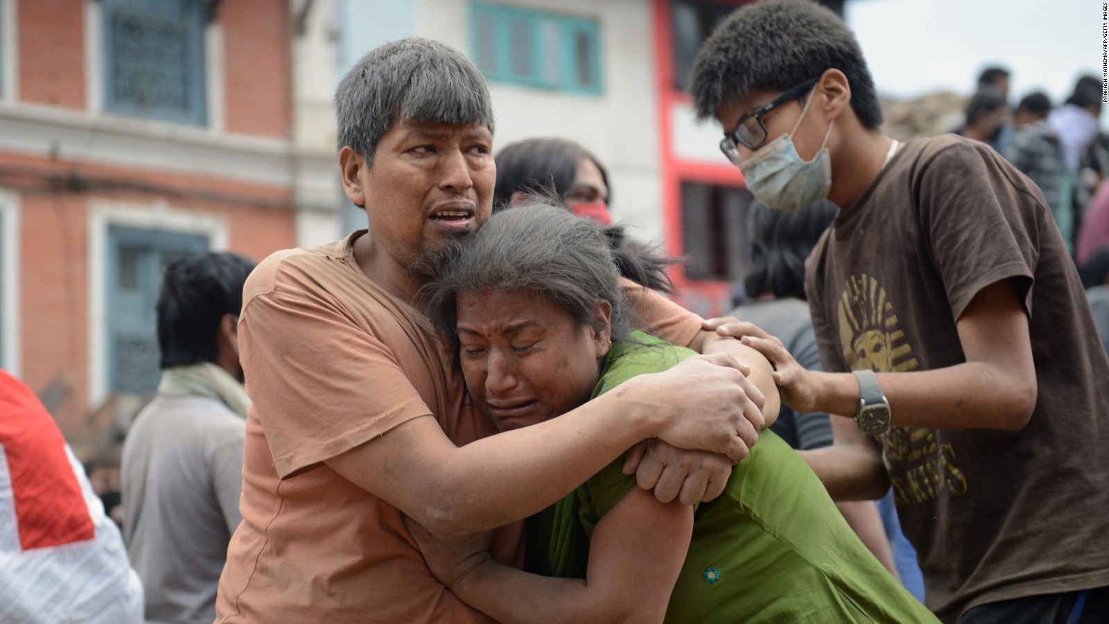 A Nepalese man and woman hold each other in Kathmandu's Basantapur Durbar Square, on Saturday, April 25. A 7.8 magnitude earthquake centered less than 50 miles from Kathmandu rocked the country on Saturday with devastating force. Hundreds have been killed and injured.