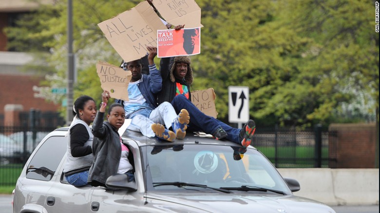 Protesters drive through the Camden Yards area on April 25.