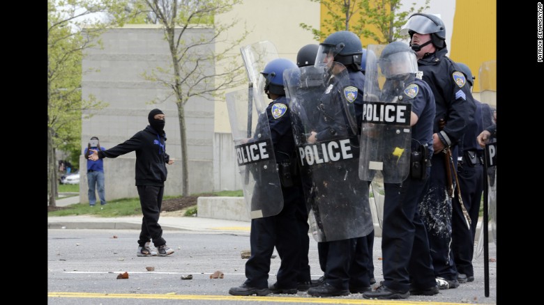 A demonstrator taunts police on April 27.