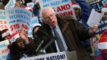 Sanders speaks to low-wage federal contract workers during a protest where the workers demanded presidential action to win an increase to $15 an hour wage on December 4, 2014, in Washington, D.C. 