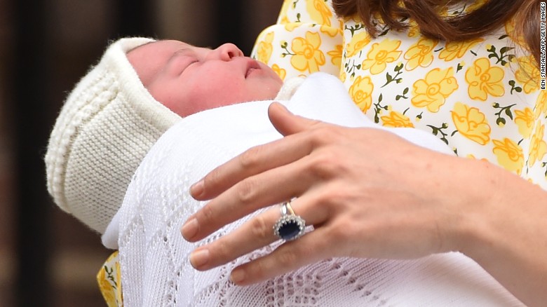 A close-up of the princess in the arms of her mother. 