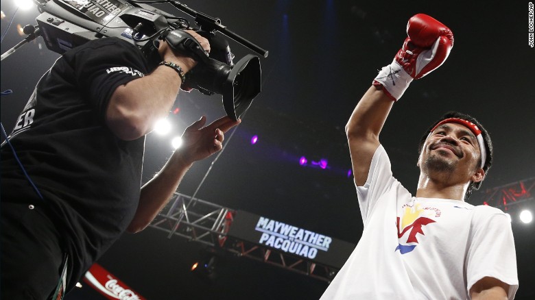 Manny Pacquiao acknowledges the crowd before the start of his world welterweight championship bout against Floyd Mayweather Jr.
