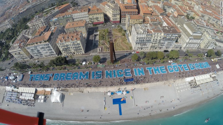 The Chinese company broke a Guinness World Record for building the largest human sentence in Nice, France.