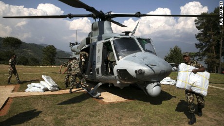 Nepali military service members unload supplies from a UH-1Y Huey in Charikot, Nepal, on May 5.