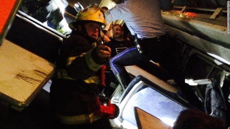 Former U.S. Rep. Patrick Murphy tweeted he was aboard the train when it crashed. &quot;Helping others,&quot; he said. &quot;Pray for those injured.&quot; Later he shared this photo that showed a firefighter inside the train.