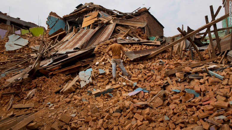 A man stands on debris in Chautara, Nepal, on Wednesday, May 13. The region was struck with a magnitude-7.3 earthquake only 17 days after a &lt;a href=&quot;http://www.cnn.com/2015/04/25/world/gallery/nepal-earthquake/index.html&quot; target=&quot;_blank&quot;&gt;magnitude-7.8 quake&lt;/a&gt; left thousands dead.