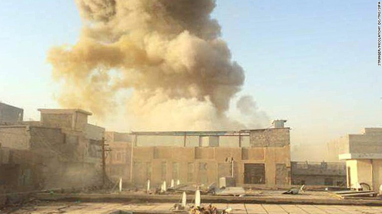 A car bomb, believed to be set by ISIS militants, explodes at the gate of a government building near the provincial governor&#39;s compound in Ramadi on Saturday, May 16.