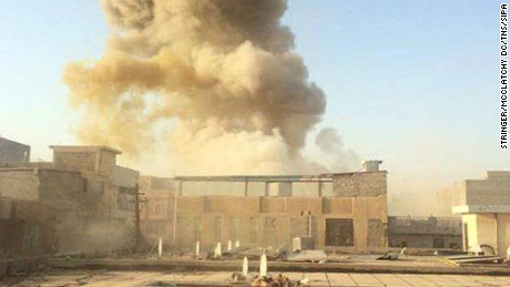A car bomb, believed to be set by ISIS militants, explodes at the gate of a government building near the provincial governor's compound in Ramadi on Saturday, May 16.