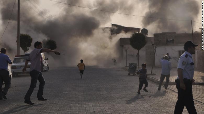 Smoke rises over the streets after a mortar bomb from Syria landed in the Turkish border village of Akcakale on October 3, 2012. Five people were killed. In response, &lt;a href=&quot;http://www.cnn.com/2012/10/03/world/europe/turkey-syria-tension/index.html&quot; target=&quot;_blank&quot;&gt;Turkey fired on Syrian targets&lt;/a&gt; and its parliament authorized a resolution giving the government permission to deploy soldiers to foreign countries.