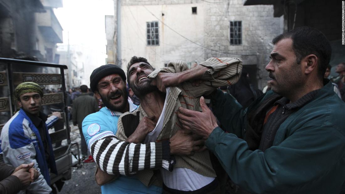 A father reacts after the deaths of two of his children in Aleppo on January 3, 2013.