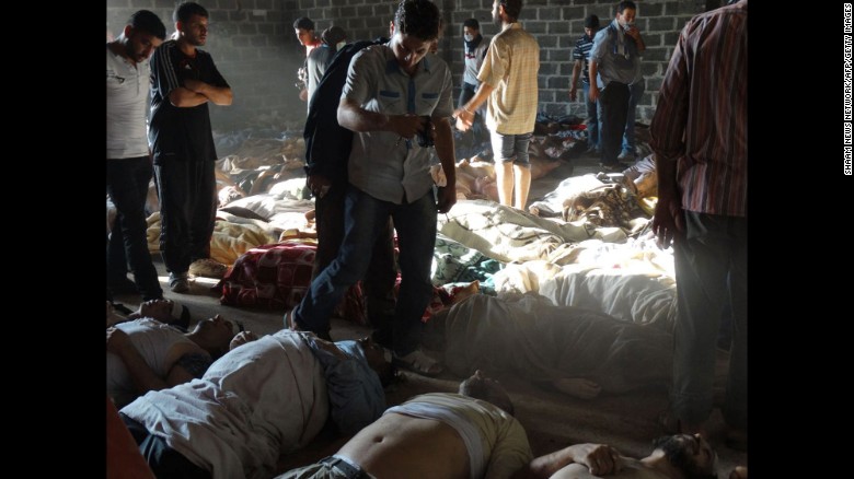 A handout image released by the Syrian opposition&#39;s Shaam News Network shows people inspecting bodies of children and adults who rebels claim were killed in a toxic gas attack by pro-government forces on August 21, 2013. A week later, U.S Secretary of State John Kerry said U.S. intelligence information found that &lt;a href=&quot;http://www.cnn.com/2013/08/30/world/europe/syria-civil-war/index.html&quot; target=&quot;_blank&quot;&gt;1,429 people were killed&lt;/a&gt; in the chemical weapons attack, including more than 400 children. Al-Assad&#39;s government claimed that jihadists fighting with the rebels carried out the chemical weapons attacks to turn global sentiments against it.