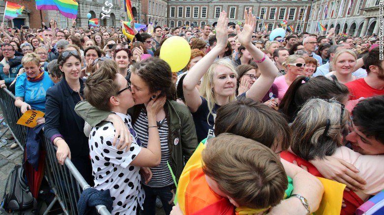 Supporters celebrate outside Dublin Castle following the announcement of the result of the same-sex marriage referendum.
