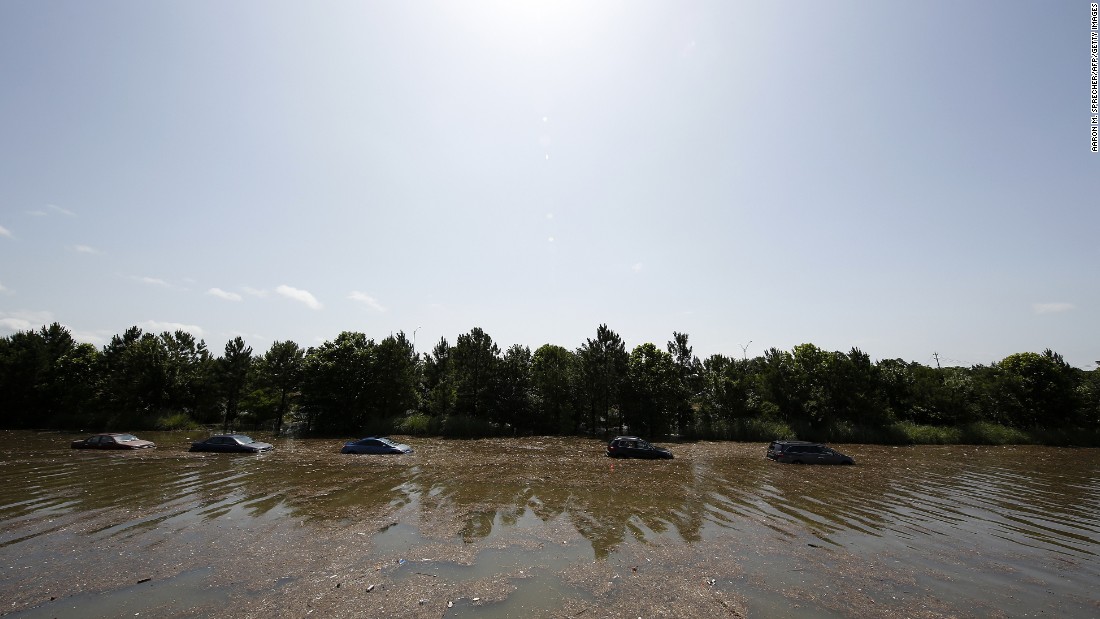 Vehicles are left stranded on Highway 288 in Houston on Tuesday, May 26. 