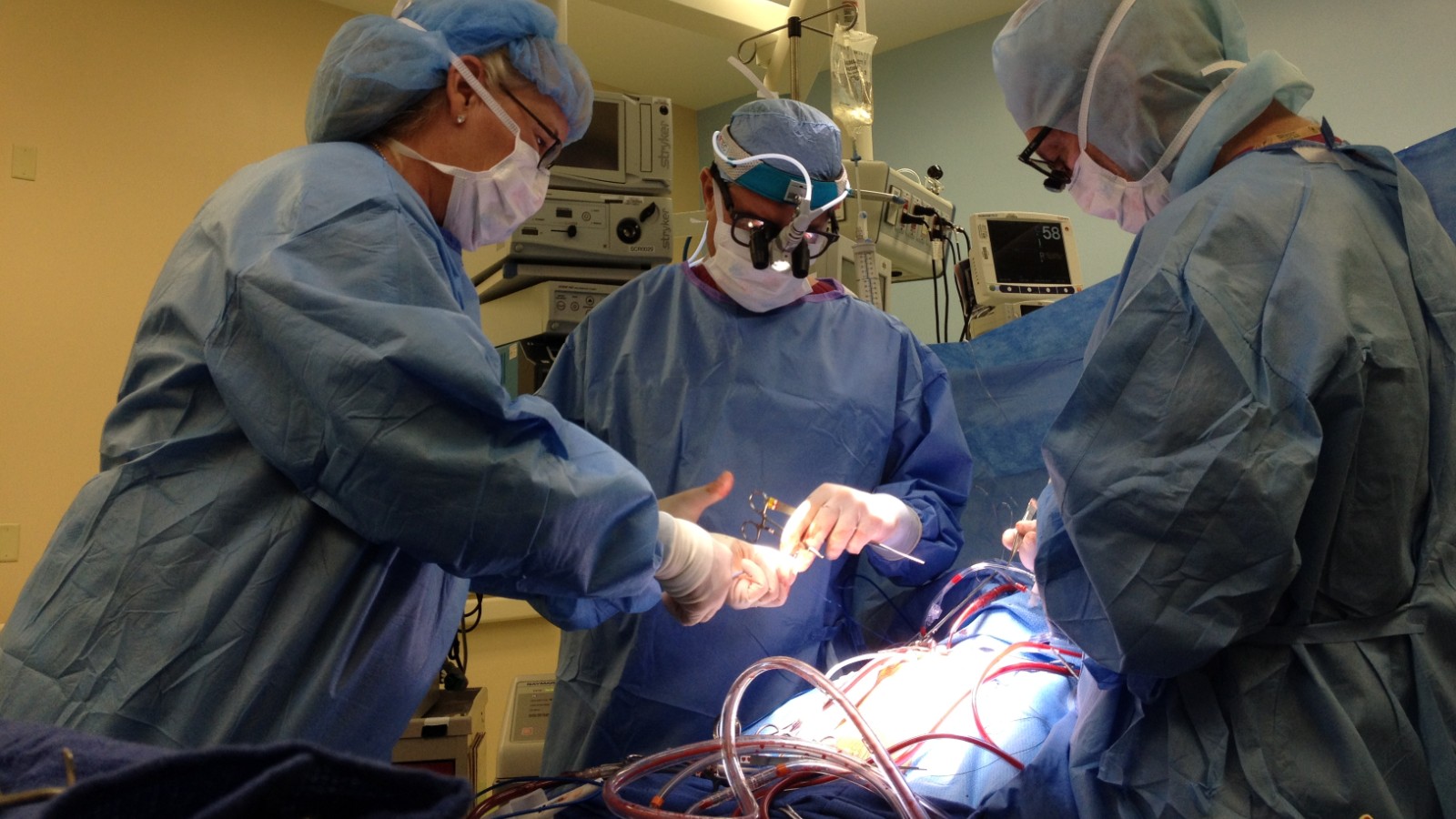 Dr. Jeffrey Jacobs (center) has pushed for pediatric heart surgery programs to be open about their death rates.